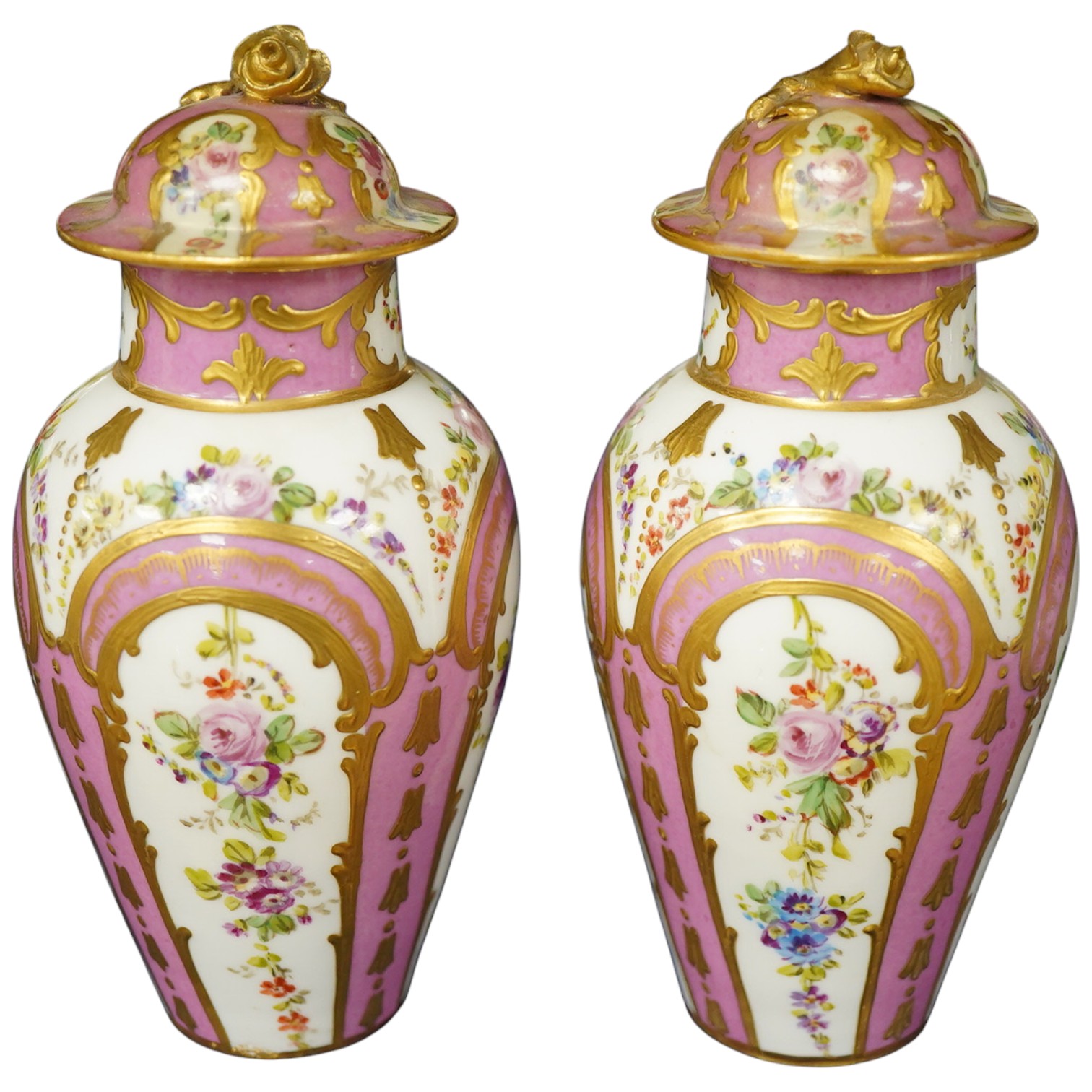 A pair of 19th century Sevres style vases and covers, marked rubbed, 15cm